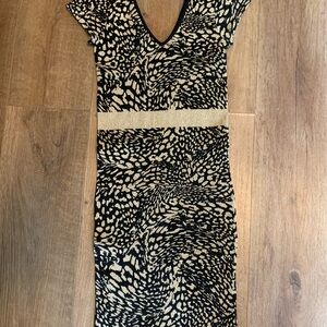 BEBE,Elegant Black and Cream Patterned Dress size s